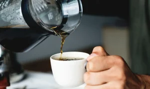 011474000_1641547521-pouring-hot-coffee-drink